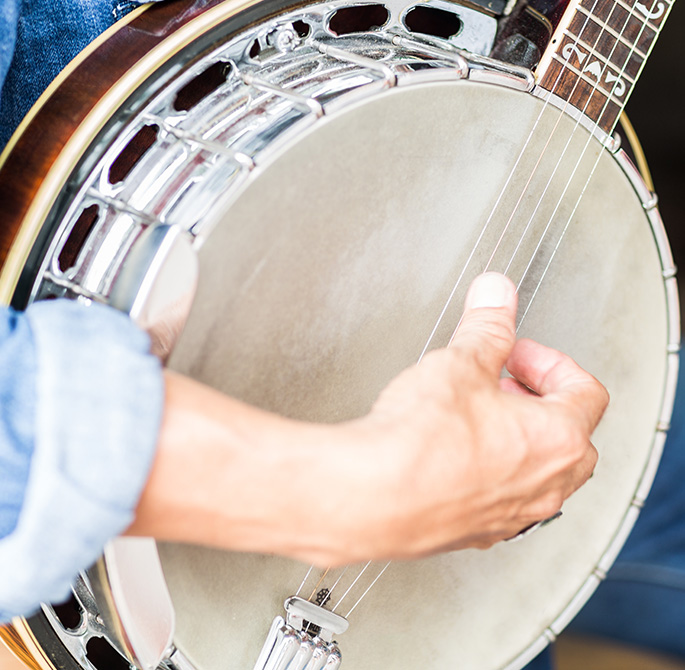 man playing banjo