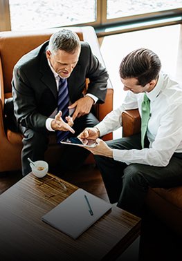 Two business men looking at tablet