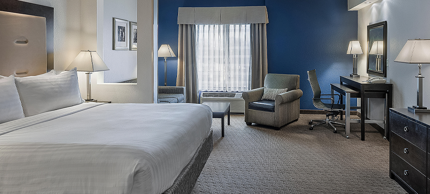 a hotel room with a blue wall
