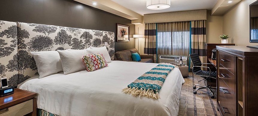 a guest room in a modern hotel room
