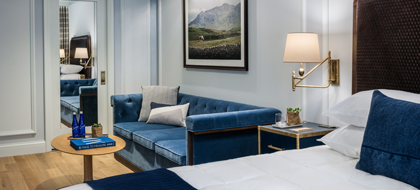 a blue sofa against a wall