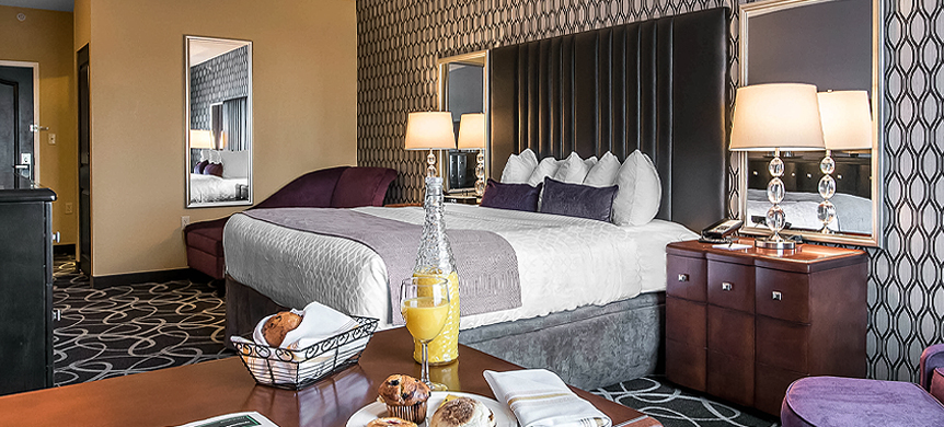 a large bed with purple walls