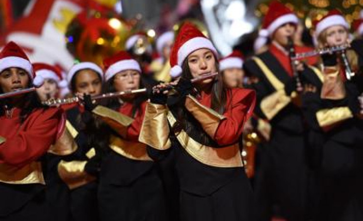 Marching Band Flute Players with Santa Caps in Christmas Parade