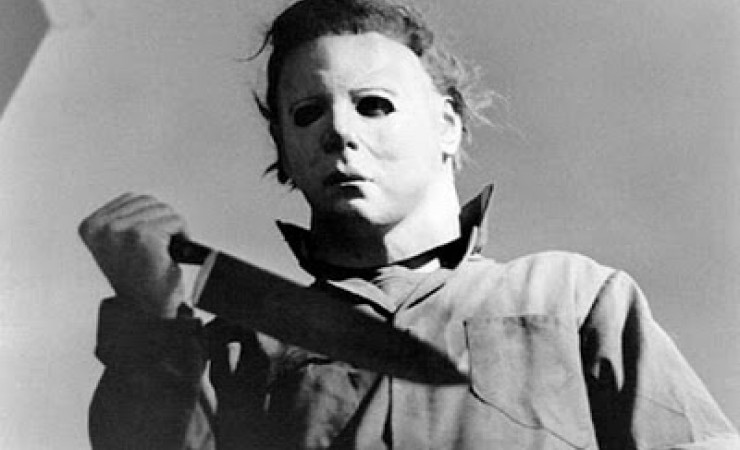 Masked Michael Myers Character with Knife in a Scene from John Carpenters movie Halloween