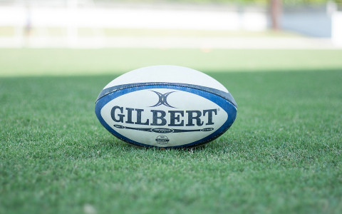 Rugby Ball on a green grass field