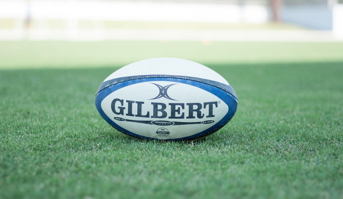 Rugby Ball on a green grass field