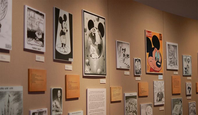 Walt Disney Family Museum. Historic drawings of Mickey Mouse line the wall