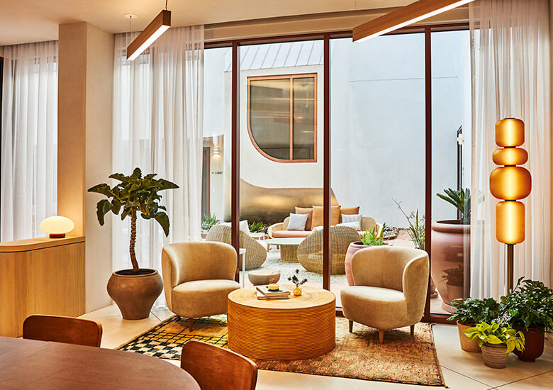 living room with chairs and sliding doors