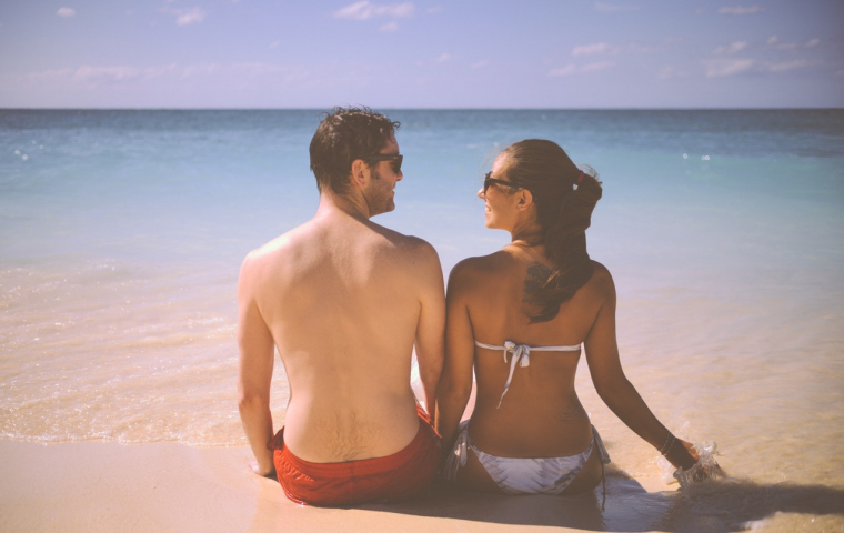 couple from behind at beach