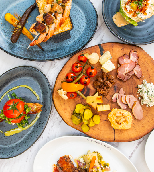 freshly made food dishes on a white table