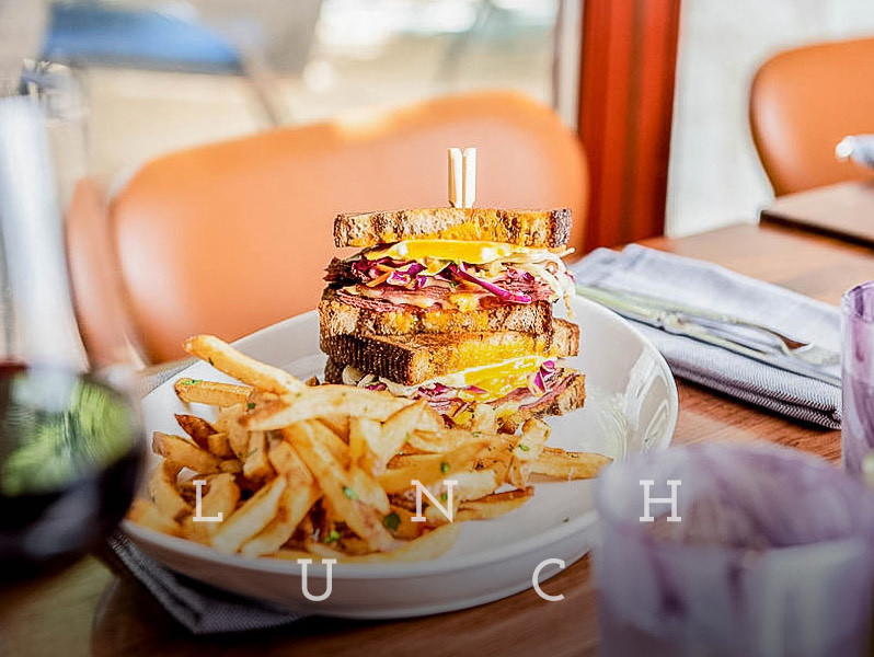reuben sandwich and fries with a text overlay that says lunch