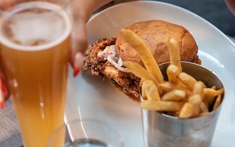 beer, and fries and sandwich on a plate