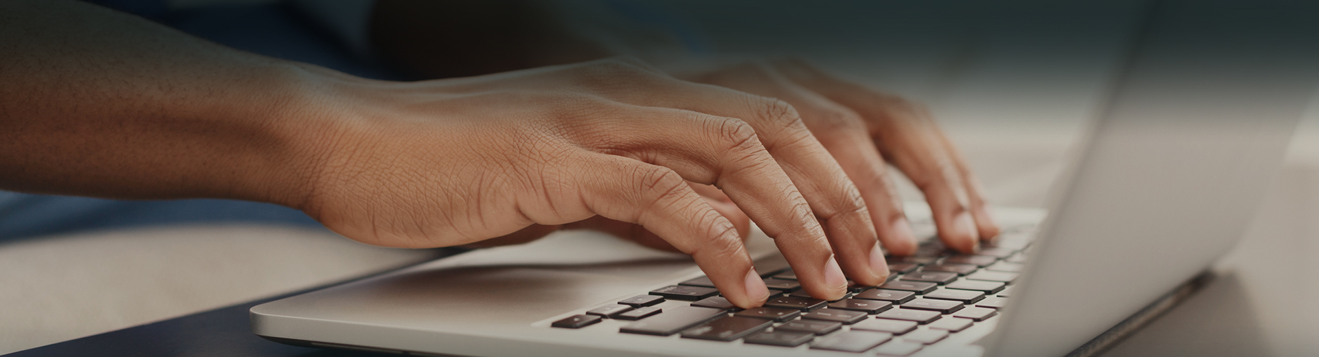 close up view of man hands typing in his laptop