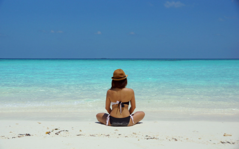 woman sitting on beach
