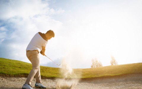 Golfer in sand