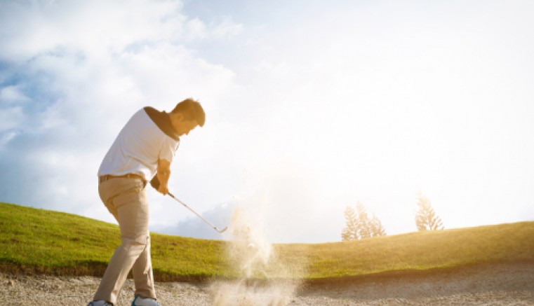 Golfer in sand
