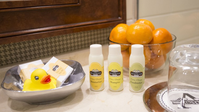 Bathroom Amenities and Oranges on Bathroom Counter