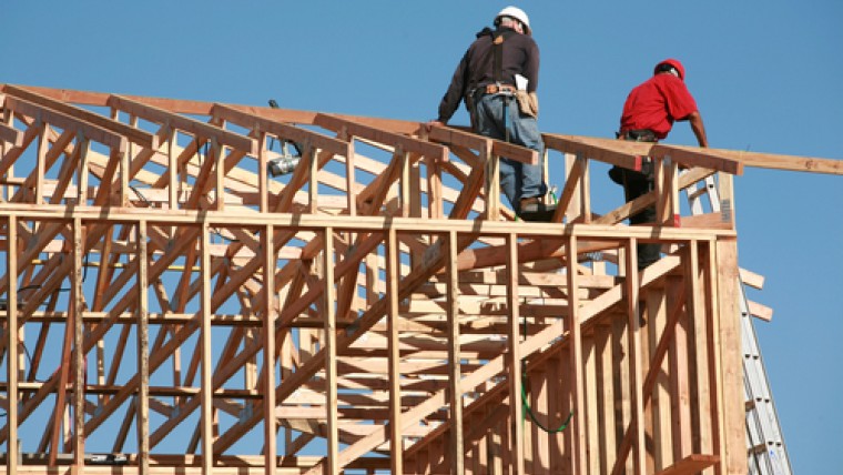 Construction Workers on The Roof of an Unfinished Building