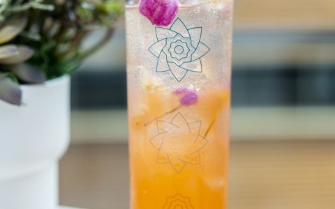 large orange cocktail with flowers