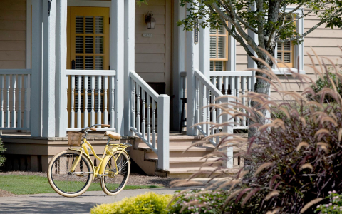 Yellow bicycle outside of house