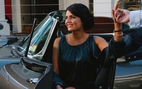 woman getting out of a car at valet