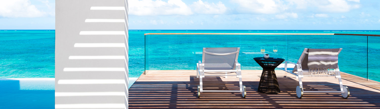 lounge chairs on waterfront deck