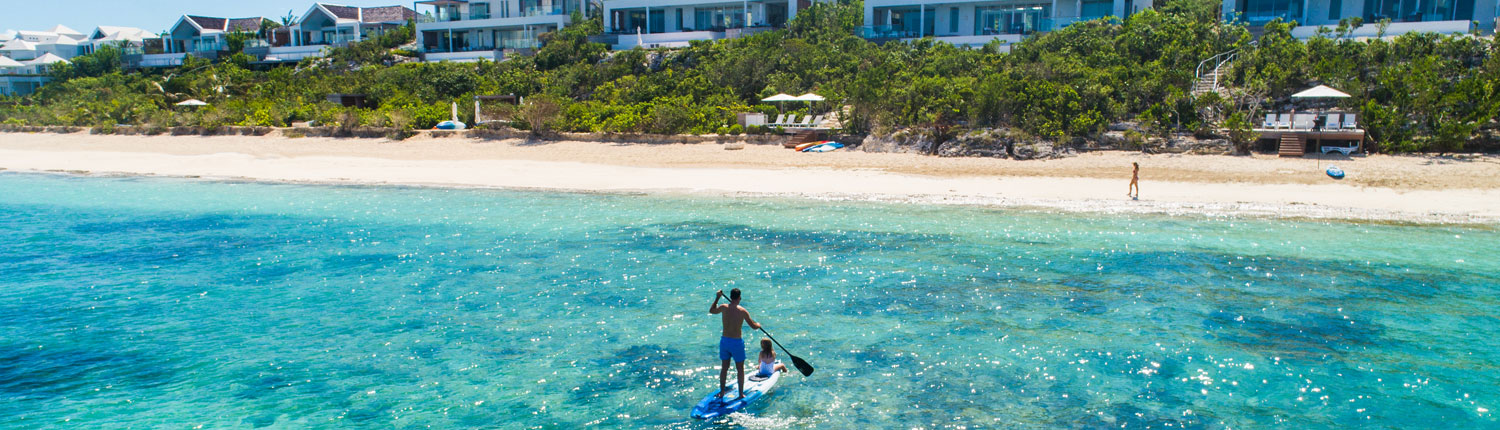man paddle boarding in the ocean
