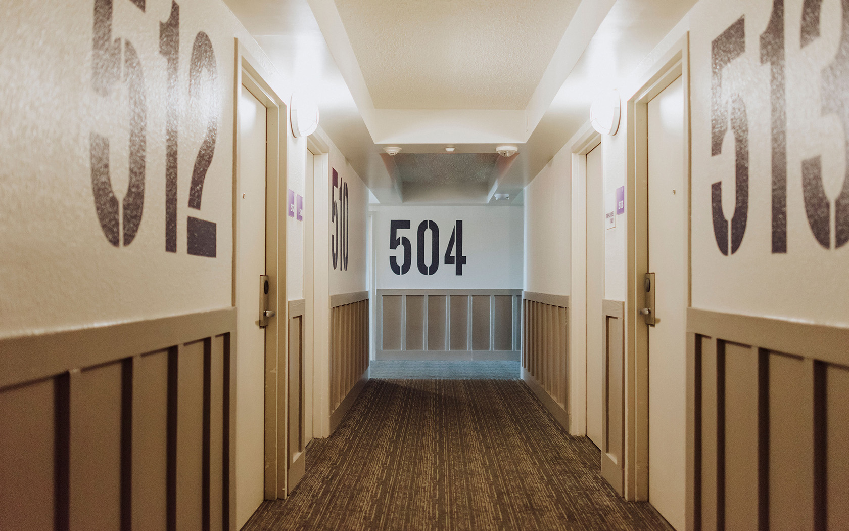 a hallway with numbers painted on the walls