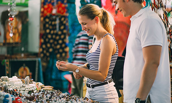 Woman browsing nicknacks at Festival Flea Market