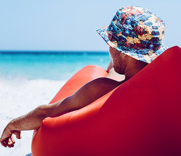 Man sitting by the ocean
