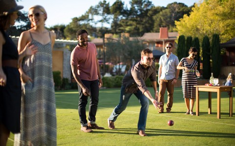 Group of people playing bocce ball