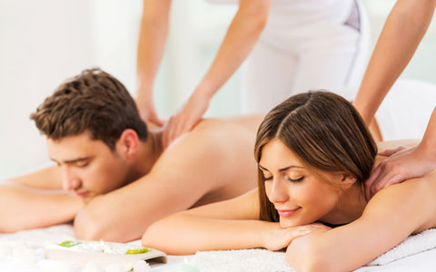 couple getting a massage at the spa