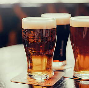 Three Glasses of Beer on Table