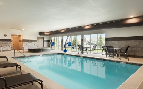 Indoor Pool, Hot Tub and Lounge Chairs