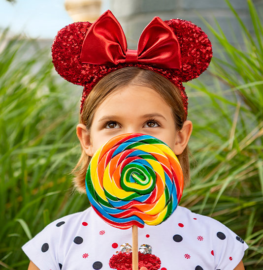 little girl in Mickey mouse ears