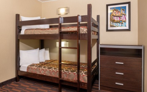 small room with twin bunkbeds 