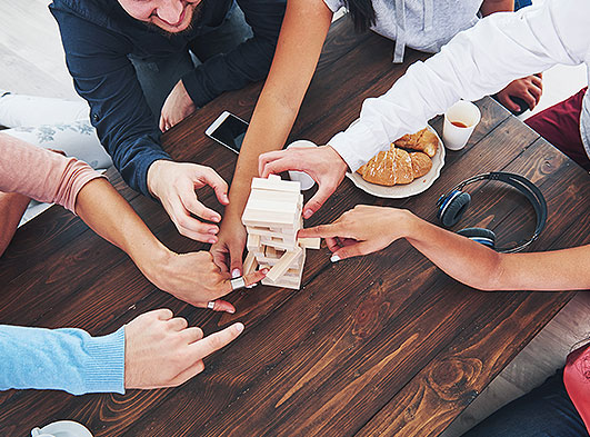 Friends playing jenga