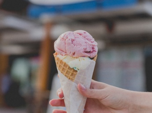 Hand holding an ice cream cone