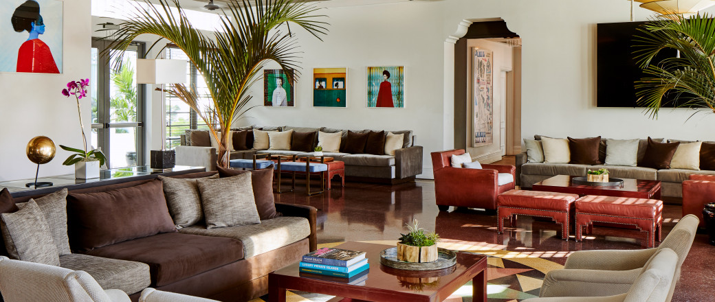 inside seating area with sofas, armchairs and tables