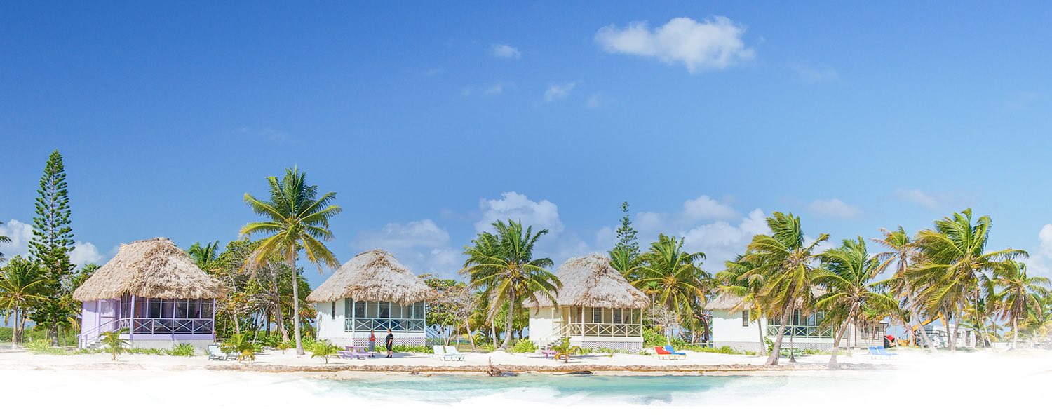 row of ocean front rooms and cabanas