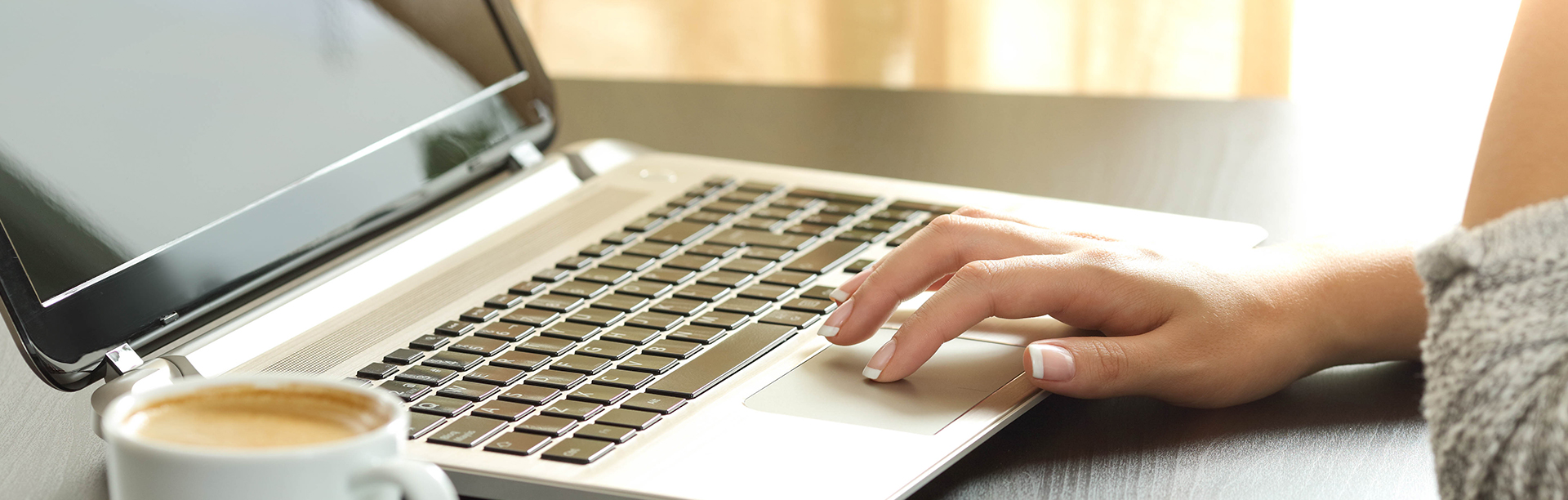 Closeup of a woman on her laptop