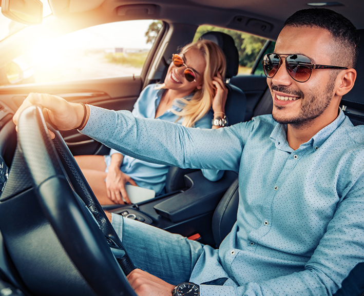 A lovely couple inside a car