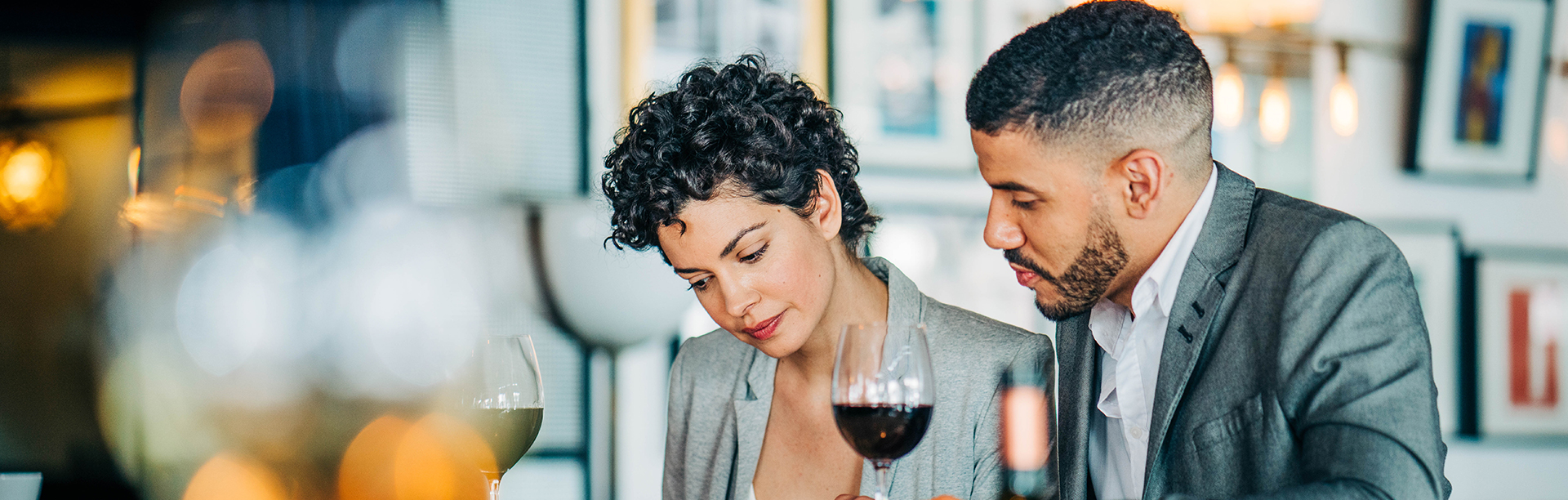 A man and a woman drinking wine