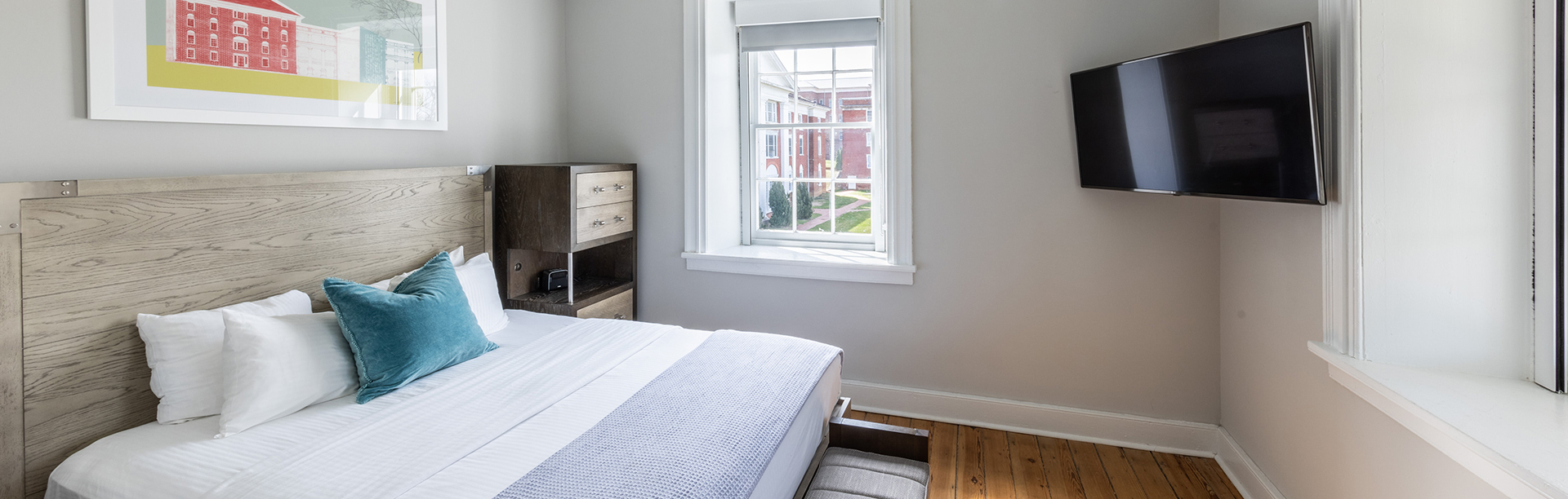 View of a big bed and a tv