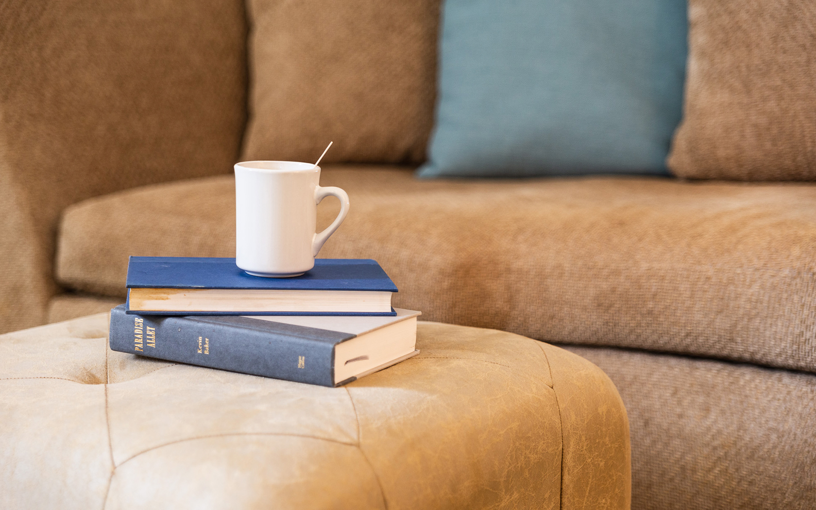  View of two books and a coffee cup on top 