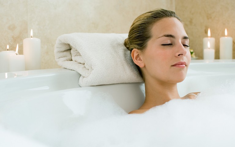 View of a relaxed woman on a bathtub
