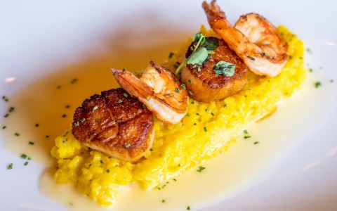 elegant shrimp dish with yellow rice