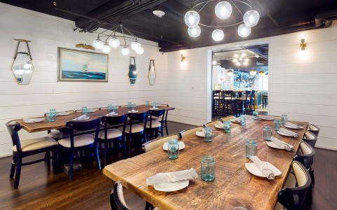 private dining room with two large rectangular table for large groups