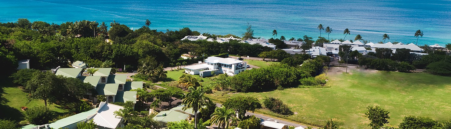 aerial view of the hotel property next to the ocean