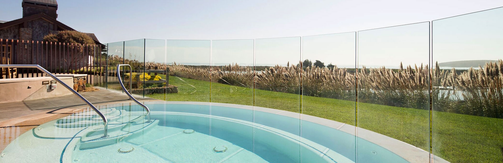 Enclosed room outdoor hot tub with see through panels to the outdoors